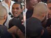 HEATED: Benn shoves Eubank Jr and pair held apart after coming face-to-face